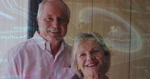 Senior Couple Smiling with Futuristic Business Data Overlay