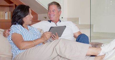 Senior Couple Enjoying Time Together on Cozy Couch