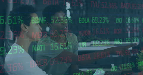 Professionals Analyzing Stock Market Data on Screen