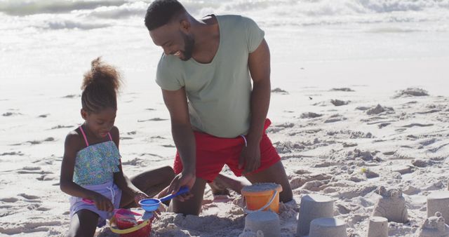 Father and Daughter Bonding While Building Sandcastles on Beach - Download Free Stock Images Pikwizard.com