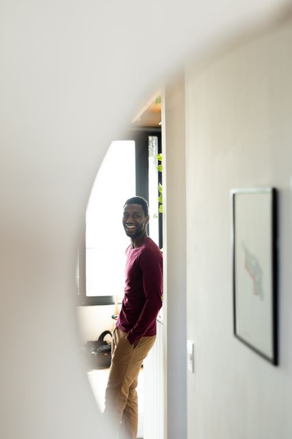 Smiling African American Man Reflected in Round Mirror at Home - Download Free Stock Images Pikwizard.com