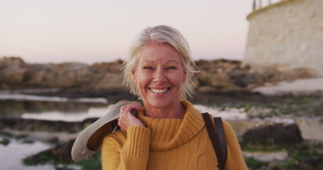 Senior Woman Enjoying Relaxing Day at the Beach - Download Free Stock Images Pikwizard.com