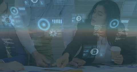 Colleagues Engaging in Data Analysis with Digital Overlays in Office Space