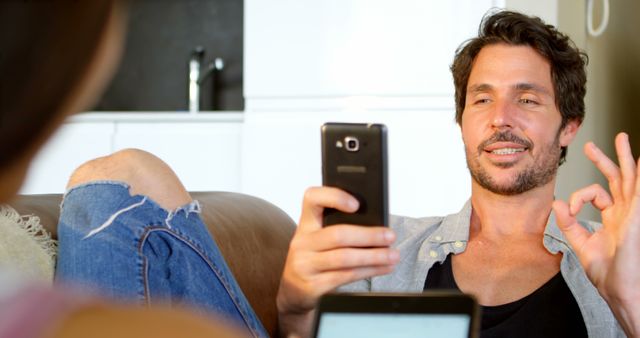 Relaxed Man Texting on Smartphone at Home - Download Free Stock Images Pikwizard.com