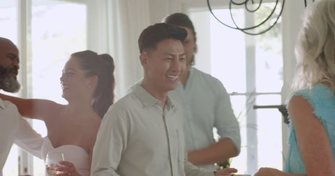 Guests celebrating in stylish indoor wedding reception