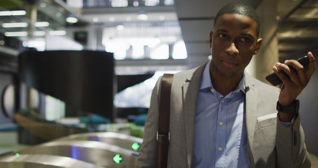 Confident Businessman Using Smartphone at Modern Office Entrance - Download Free Stock Images Pikwizard.com