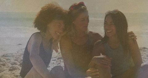 Smiling Women Embracing Friendship at Sunny Beach