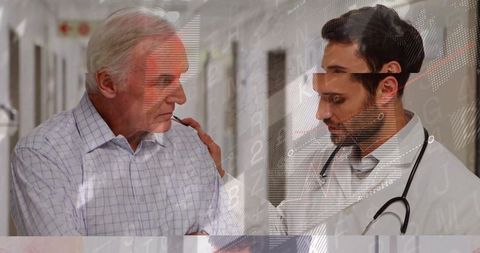 Compassionate Doctor Encouraging Senior Patient in Hospital