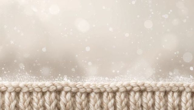 Cream chunky knit border featuring soft wool loops and cozy bokeh winter sparkle