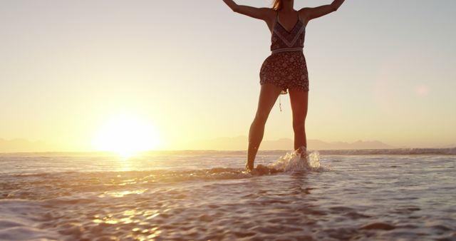 Woman Enjoying Sunset on Beach - Download Free Stock Images Pikwizard.com