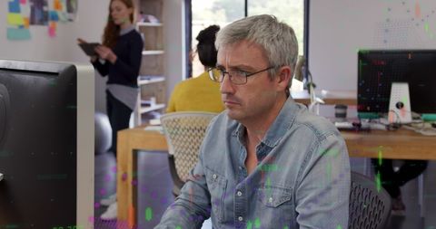 Caucasian Businessman Analyzing Financial Data in Office