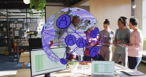 Collaborating around holographic globe in open office with laptop-driven data visualization