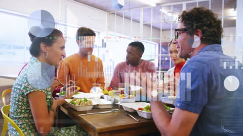 Diverse Team Analyzing Data During Office Luncheon