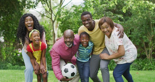 Image of happy african american family having fun together in garden. family, togetherness, spending quality time together outdoors.