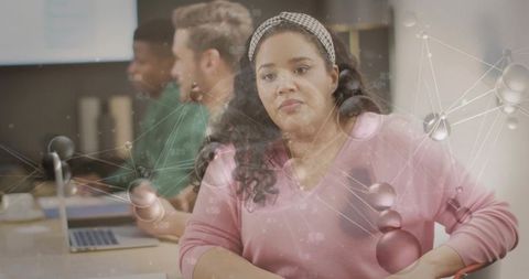 Woman Collaborating in Office with Network Graphic Concept