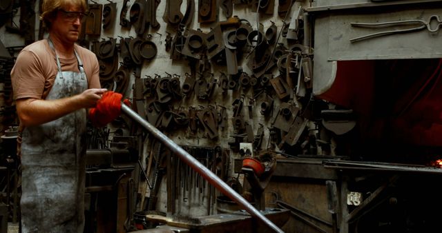 Skilled Blacksmith in Artisan Workshop Working with Red-Hot Metal - Download Free Stock Images Pikwizard.com