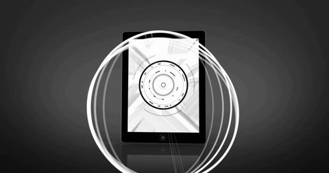 Monochrome tablet with futuristic circular hud and light trail rings on glossy surface
