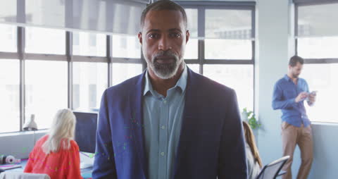 Confident Businessman in Modern Office Environment with Graph Animation