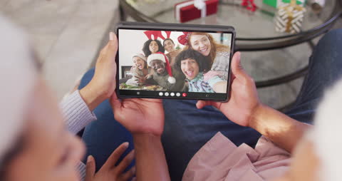 Festive Virtual Gathering on Tablet with Diverse Friends Celebrating Together