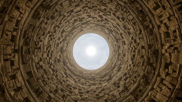 Circular sky view through ancient stone shaft