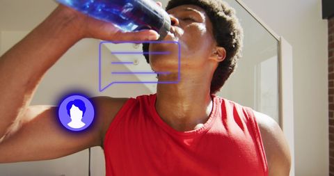 Hydrating After Workout: Thirsty Young African American Man Drinking Water