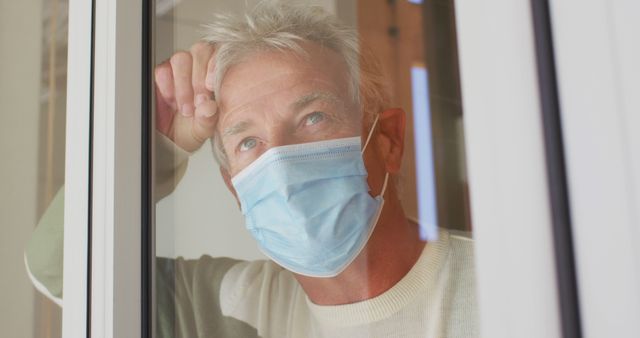 Senior Man Wearing Face Mask Looking Through Window - Download Free Stock Images Pikwizard.com