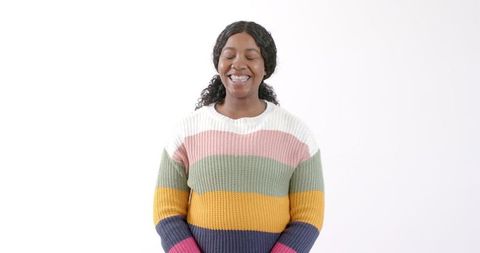 Confident african american woman smiling in colorful sweater