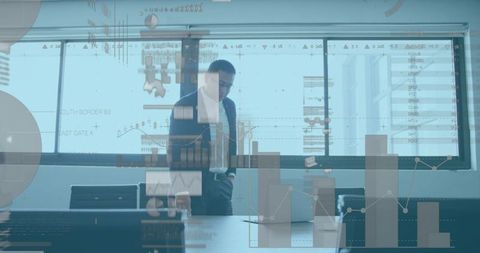 Businessman Analyzing Data with Holographic Charts - Download Free Stock Images Pikwizard.com