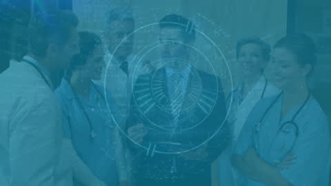 Businessman Collaborating with Medical Professionals on Technology