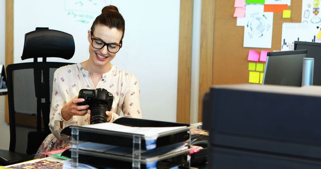 Young Woman Working in Creative Office with Digital Camera - Download Free Stock Images Pikwizard.com