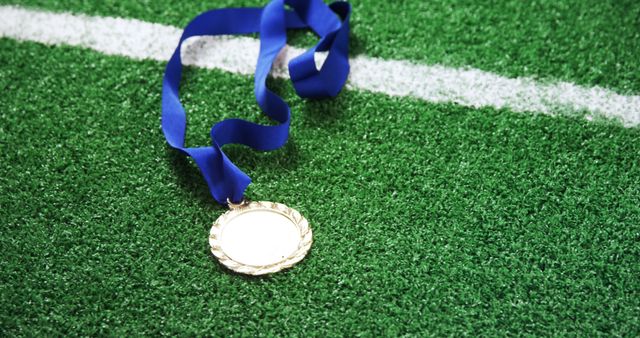 Gold Medal with Blue Ribbon on Grass Turf - Download Free Stock Images Pikwizard.com