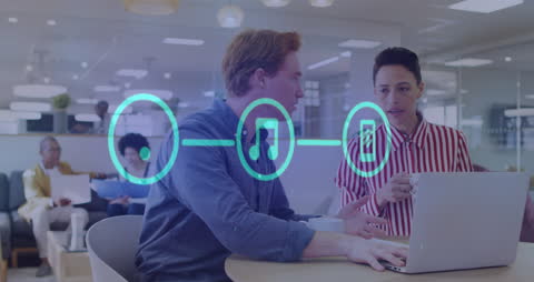 Colleagues Discussing Digital Data Processing in Modern Office