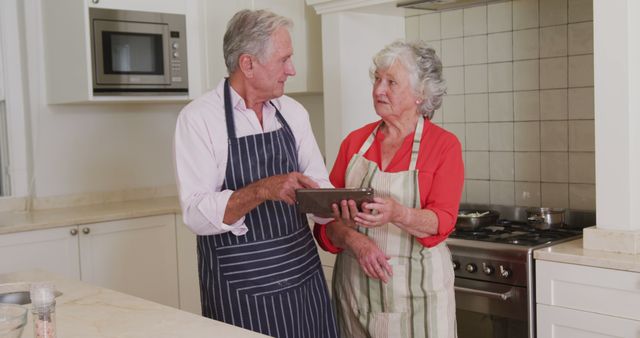 Elderly Couple Baking Together in Kitchen, Sharing Romantic Moments - Download Free Stock Images Pikwizard.com
