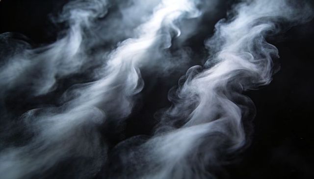 Ethereal smoke plumes drifting diagonally over black background with fine particle texture