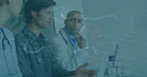 Doctors Discussing Healthcare Data Analytics with Laptops