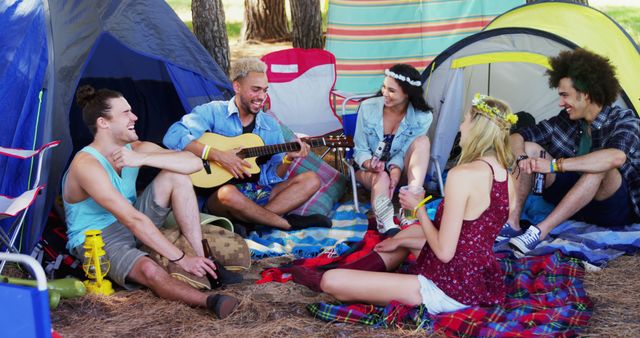 Group of Friends Enjoying Camping in Nature, Playing Guitar and Laughing - Download Free Stock Images Pikwizard.com