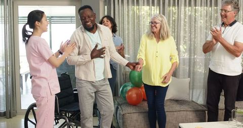 Diverse patients and nurse welcoming new physiotherapy patient