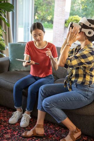 Mother and Daughter Experiencing Virtual Reality at Home