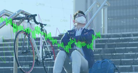 Asian Businessman Analyzing Data During Pandemic Outdoors