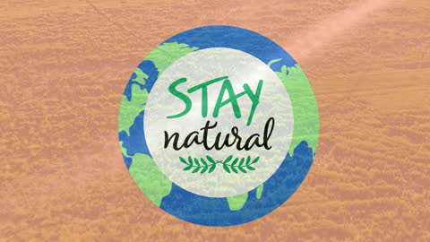 Stay Natural Message with Globe Overlay on Golden Fields