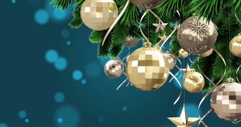 Christmas Baubles Hanging from Decorated Evergreen Branch