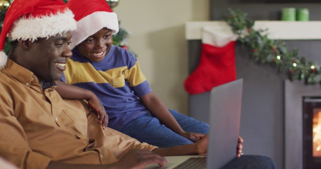 Father and Son Celebrating Christmas with Laptop - Download Free Stock Images Pikwizard.com