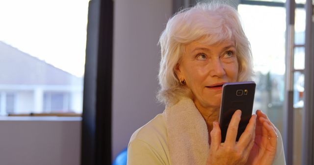 Senior Woman Using Voice Assistant on Smartphone for Communication - Download Free Stock Photos Pikwizard.com