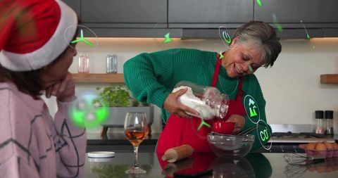Senior woman pouring flour while baking with family, ar icons overlay, festive kitchen