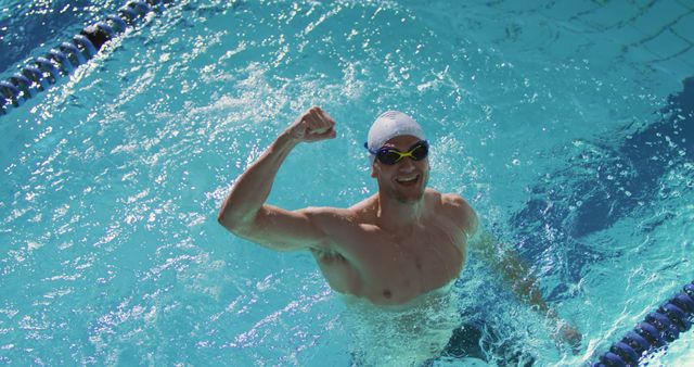 Professional Swimmer Celebrating Victory in Swimming Pool - Download Free Stock Images Pikwizard.com