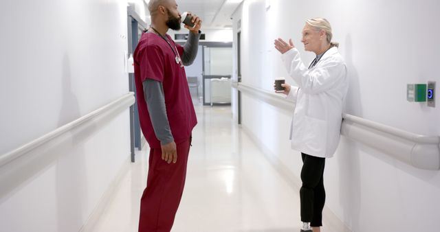 Healthcare Professionals Taking a Coffee Break in Hospital Corridor - Download Free Stock Images Pikwizard.com