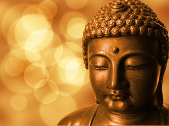Depicts a peaceful Buddha statue against a golden bokeh background. Ideal for use in articles or posts about spirituality, meditation, mindfulness, and zen practices. Can be used in websites, pamphlets, and presentations related to spiritual growth, tranquility retreats, and religious symbolism.