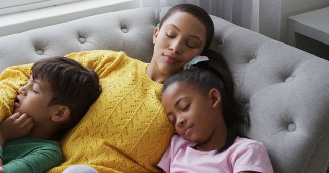 Mother Relaxing with Her Children on Couch - Download Free Stock Images Pikwizard.com