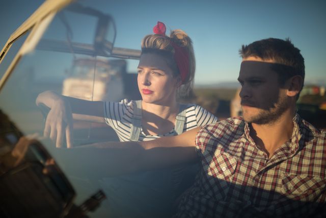 Young couple sitting together in a car