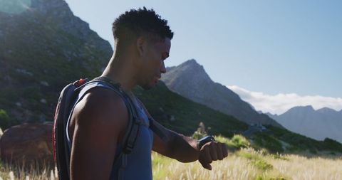 Athletic Man Hiking in Mountain Checking Smartwatch - Download Free Stock Images Pikwizard.com